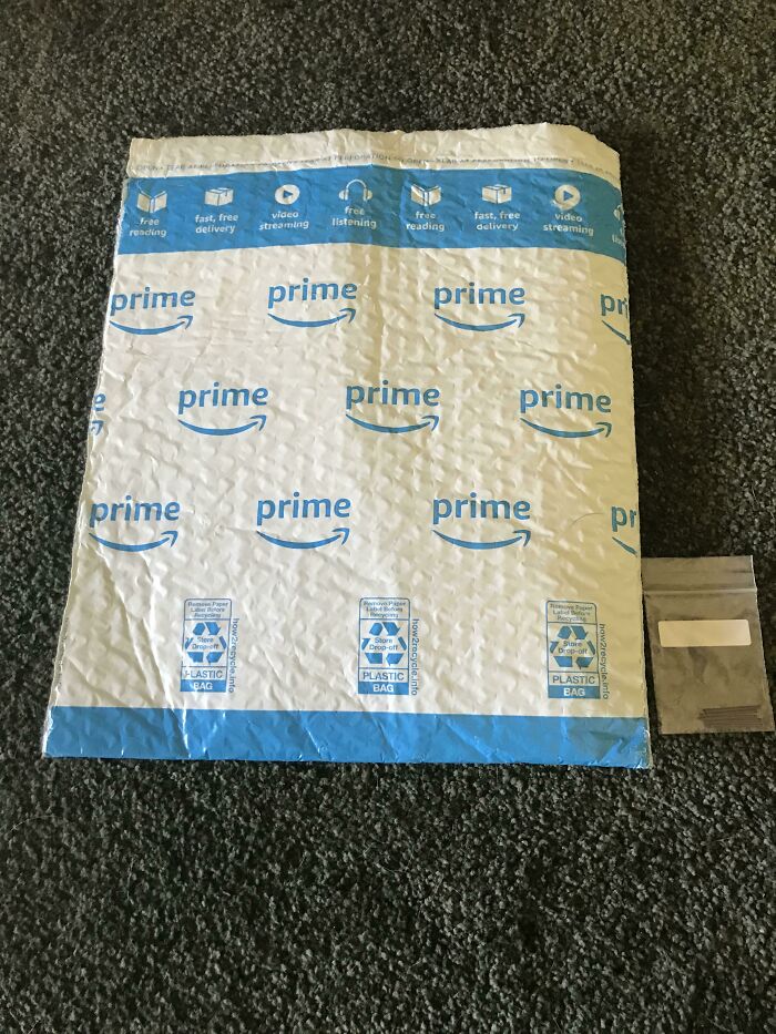 Huge padded envelope next to tiny tiny zip bag inside showing packaging fails.