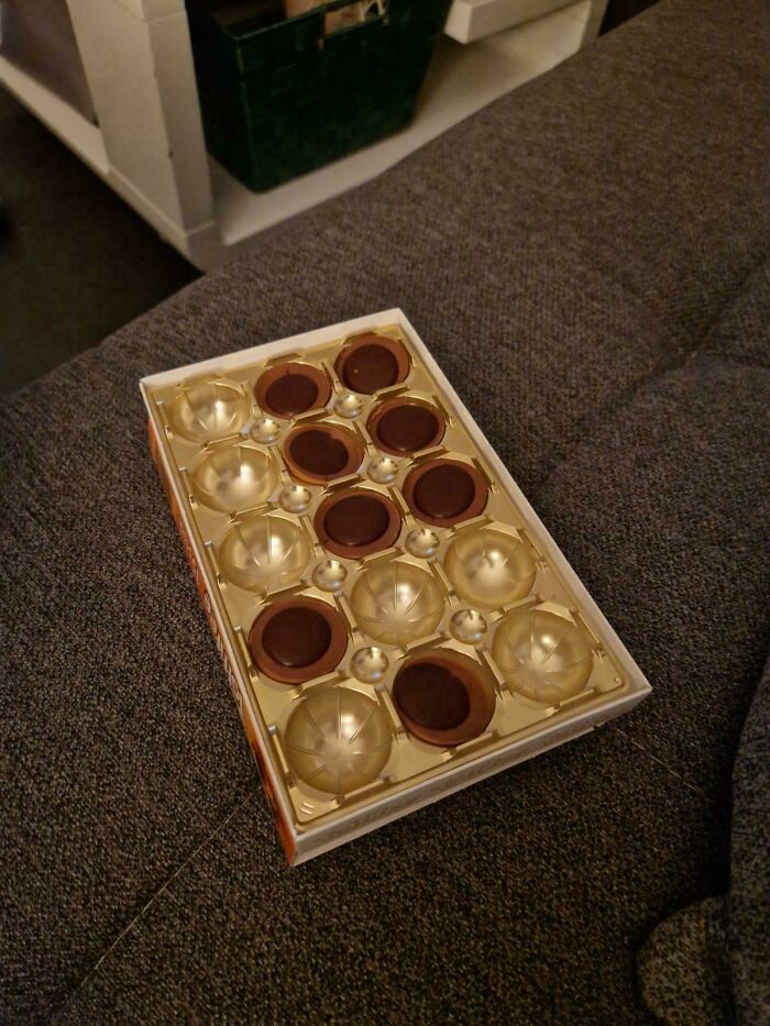Box of chocolates with only half the pieces eaten, showing husband's funniest quirks