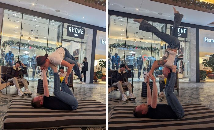 Influencers practicing acroyoga stunts in a public mall concourse area.