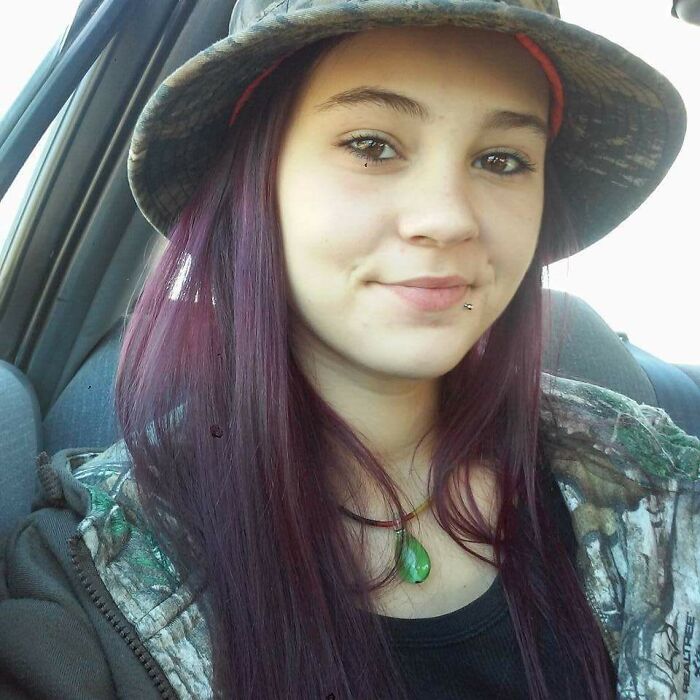 Young woman with purple hair in a car captured in photos for the last time