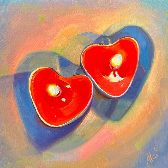 Alai Paintings of two glowing heart-shaped candles in vibrant red and blue colors