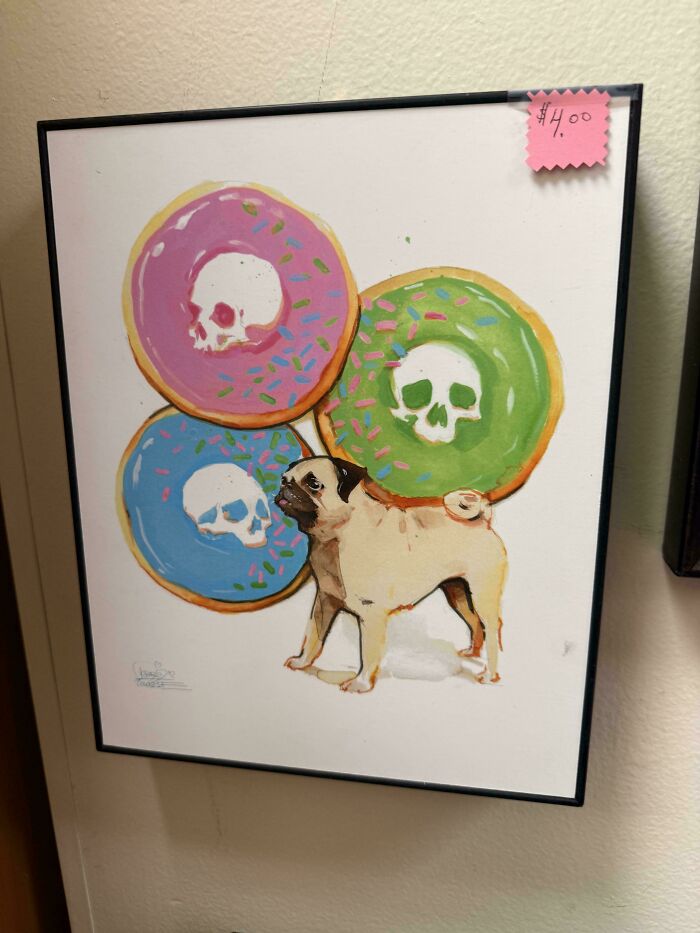 Framed painting of a pug dog standing with decorated donuts as a unique thrift store find
