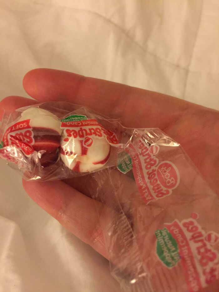 Single hard candy individually wrapped inside a comically large plastic wrapper, showing bad packaging fails.