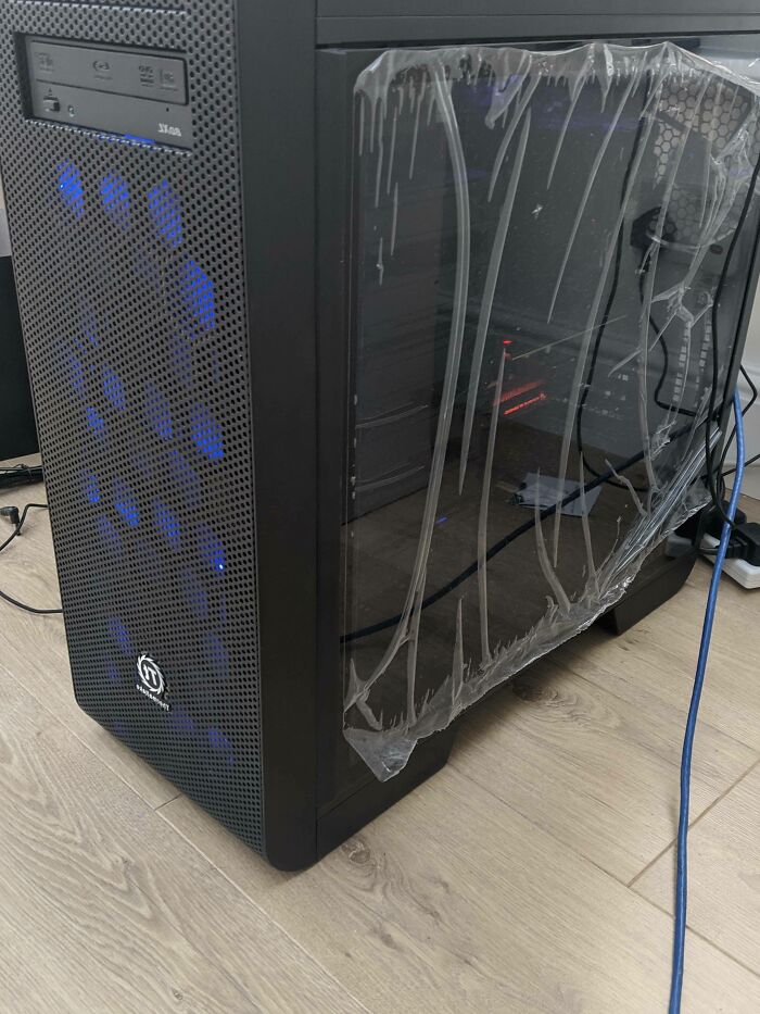 A brand new computer tower with the protective plastic film still on, highlighting funny husband quirks.